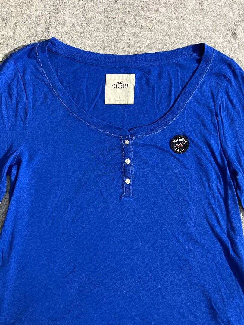 Hollister (Category: Activewear) located in Manila. Submitted by zenwind_3cdc42 (Listing ID 1469071690, Image 2). Description: Hollister long-sleeve henley shirt • Royal Blue Color 10/10 color rate • Excellent Condition • 24x18 Dimension Large on tag • Ship thru j&t // lalamove // door to door • Payment thru Gcash // Cash DM me to Claim or Comment down below.