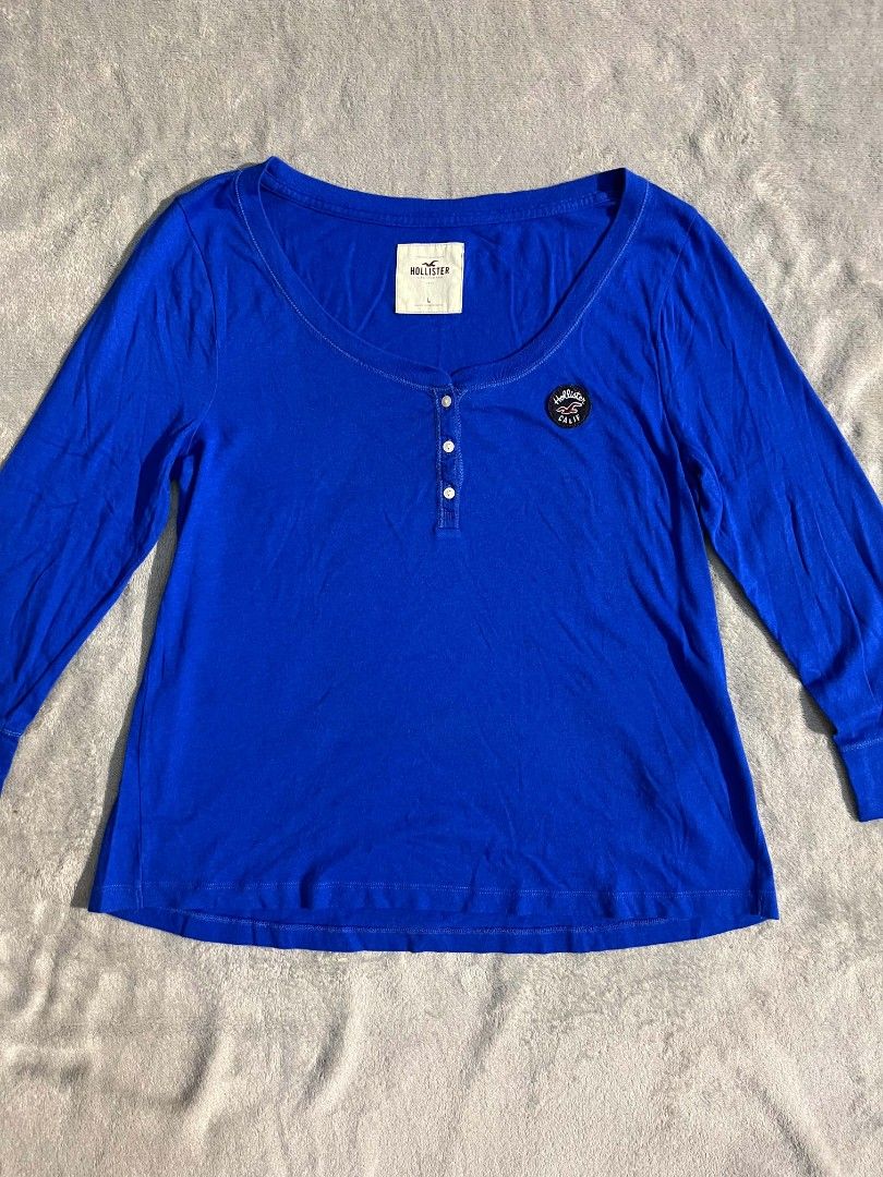 Hollister (Category: Activewear) located in Manila. Submitted by zenwind_3cdc42 (Listing ID 1469071690, Image 1). Description: Hollister long-sleeve henley shirt • Royal Blue Color 10/10 color rate • Excellent Condition • 24x18 Dimension Large on tag • Ship thru j&t // lalamove // door to door • Payment thru Gcash // Cash DM me to Claim or Comment down below.