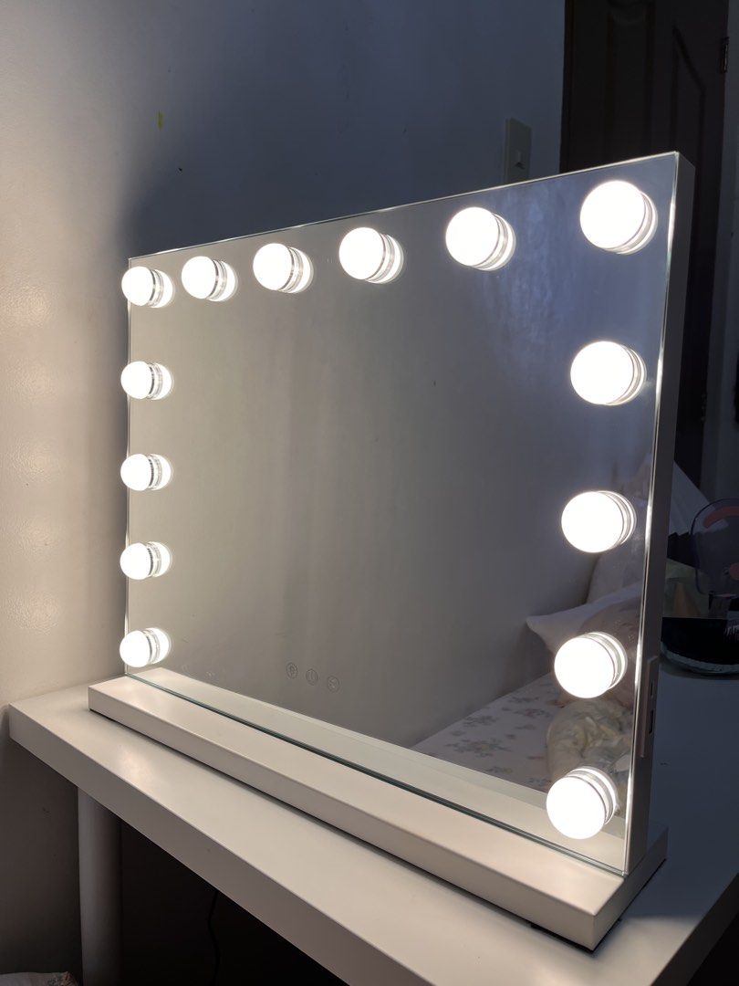 Hollywood Makeup Mirror with LED Bulbs and White Base (Category: Mirrors) located in Cavite. Submitted by luvysai (Listing ID 1468980714, Image 1). Description: 50cm 42cm - Large tabletop vanity mirror with all-around built-in LED bulbs - Sleek white rectangular wooden base with clean edges - Convenient touch sensor controls located at the bottom center - Bright, working lights perfect for flawless makeup application - Ideal addition to any white