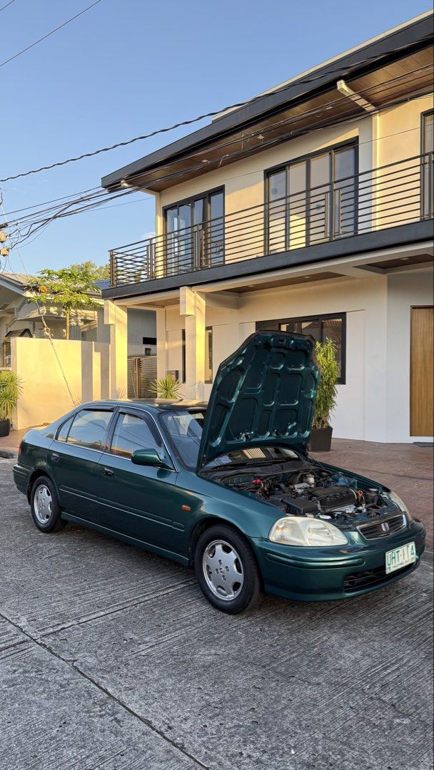 Honda Civic 1.6 VTI (A) (Category: Used Cars) located in Manila. Submitted by euviepollack (Listing ID 1469099381, Image 2). Description: For sale! ₱158,000 RUSH NEGOTIABLE‼️ FRESH unmolested Honda Civic VTI bigote 1998 model Automatic transmission. - Binyahe ng 9 HOURS STRAIGHT! zero problem. zero issues engine. - Kahit ilong drive muna natin bago niyo bayaran, basta sagot niyo gas unli hataw😅 - Bone stock engine walang kahit anong aftermarket 