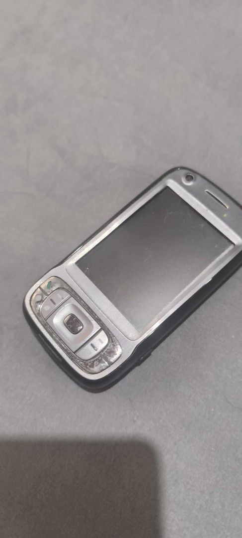 Htc tytn II (Category: Early Generation Mobile Phones) located in Quezon City. Submitted by thehouseofclassics (Listing ID 1468941196, Image 1). Description: - Brand/Model: HTC TyTN II - Classic Windows Mobile smartphone with slide-out QWERTY keyboard - Equipped with a 3.0 MP camera and flash - Visible scratches and wear on the back cover and body indicating past use - Ideal collector's item or display piece for retro tech lovers issue: no batter