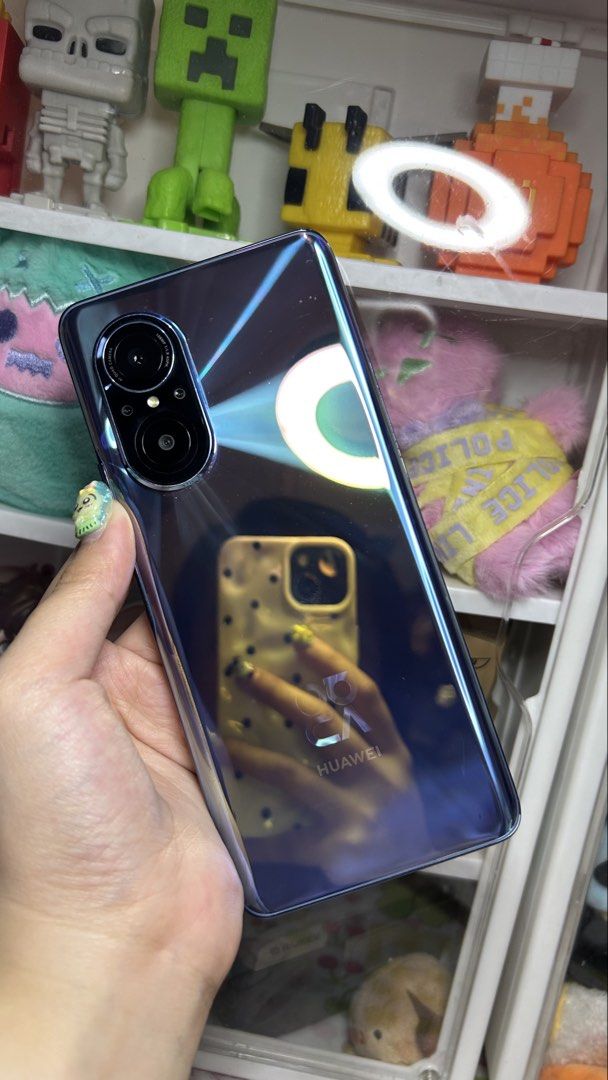 Huawei Nova 9 SE (Category: Huawei) located in Manila. Submitted by yume_artsss (Listing ID 1468984934, Image 2). Description: - Brand/Model: Huawei Nova 9 SE - Storage: 128GB - Design: Stylish, slim profile with a glossy, light-reflecting back finish - Condition: Well-maintained and in great shape, used it for 20 times only - Inclusions: Includes a stylish patterned phone case - I can send more videos for more details and smoothness of the devic