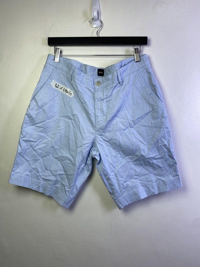 Hugo Boss Light Blue Textured Shorts Size 32 (Category: Shorts) located in Manila. Submitted by declutterpromax (Listing ID 1468976402, Image 1). Description: - Brand: Hugo Boss - Color: Light blue with textured fabric - Size: 32 waist (10-inch inseam) - Closure: Button fly - Pockets: Front slant pockets and dual back welt pockets with button closures - Details: Signature small metal Hugo Boss logo plate on the right back pocket - Condition: Grea