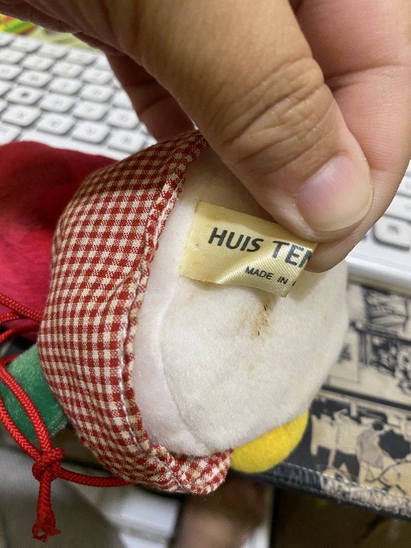 Huis Ten Bosch Plush Toy (Category: Plushies & Soft Toys) located in Imus. Submitted by mnmv23 (Listing ID 1468996687, Image 3). Description: - Official Huis Ten Bosch merchandise featuring an original tag - Cute red tulip plush with green leaves and yellow feet - Wears a red and white checkered dress with a gold bell necklace - Equipped with a hanging red string loop for easy display - Flaw note: Has slight age spots and discoloration on the whi