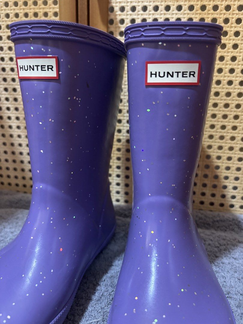 Hunter Purple Glitter Rain Boots (Category: Babies & Kids Fashion) located in Manila. Submitted by wardrobeinmnl (Listing ID 1469048137, Image 2). Description: SIZE: 13(US) - Authentic Hunter rain boots in a fun bright purple shade - Covered in eye-catching silver glitter specks all over - Mid-calf height featuring classic textured rubber toe cap - Adjustable side buckle detail for a better fit - Distinctive red and white Hunter logo patch on the
