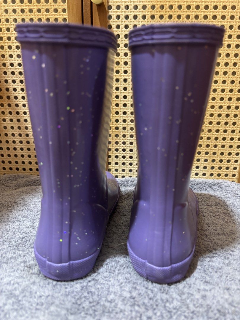 Hunter Purple Glitter Rain Boots (Category: Babies & Kids Fashion) located in Manila. Submitted by wardrobeinmnl (Listing ID 1469048137, Image 3). Description: SIZE: 13(US) - Authentic Hunter rain boots in a fun bright purple shade - Covered in eye-catching silver glitter specks all over - Mid-calf height featuring classic textured rubber toe cap - Adjustable side buckle detail for a better fit - Distinctive red and white Hunter logo patch on the