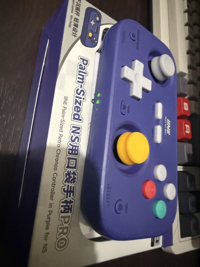IINE Palm-Sized Retro Chronos Controller Purple for Nintendo Switch (Category: Controllers) located in Quezon City. Submitted by gritxfaith (Listing ID 1469122676, Image 3). Description: Sa switch ko sya nagamit at iphone pero pwede to sa lahat! Mas mabilis ang response kesa sa 8bitdo ultimate 2c both wired at bluetooth. Ginamit lang pang retro games for a very few times. - Item: IINE Palm-Sized Retro Chronos Controller - Color: Purple with GameC