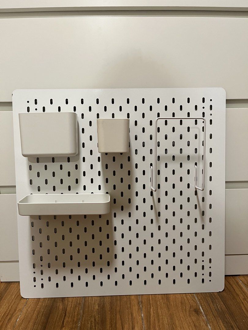 IKEA White Pegboard with Accessories and Hooks (Category: Home Improvement Tools & Accessories) located in Taytay. Submitted by prelovedbyblaire (Listing ID 1469091658, Image 1). Description: - DUPE IKEA SKÅDIS pegboard organizer in white (56x56cm) - Complete bundle with all accessories included as shown - Comes with storage containers, a shelf, and a metal rack - Includes 6 white hooks for hanging items - Complete with 2 mounting screws and spac