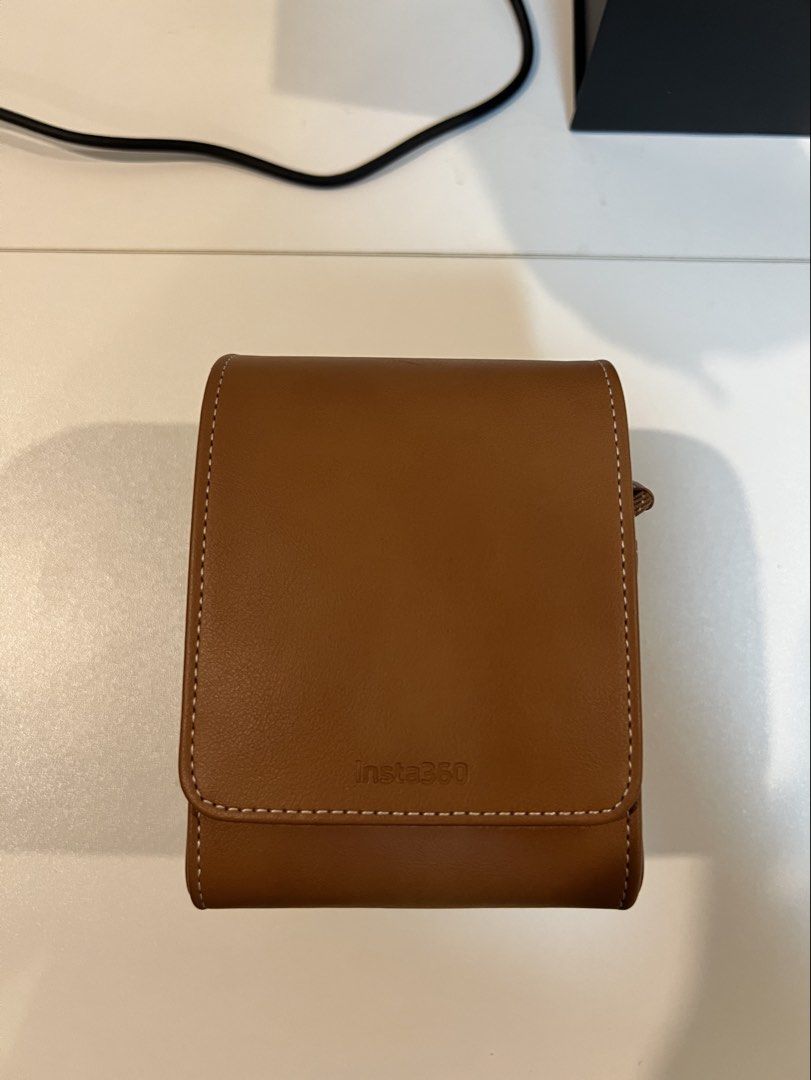 Insta360 Classic Leather Case (Like New, Complete Set with Box) (Category: Camera Bags & Carriers) located in Antipolo. Submitted by vistrove (Listing ID 1469160657, Image 2). Description: Selling an authentic Insta360 Classic Leather Case in pristine, like-new condition. Condition: Like New / Barely used — crisp condition with zero wear, scratches, or scuffs Compatibility: Fits Insta360 Ace, Ace Pro, and Ace Pro 2 Color: Rich Brown with matching