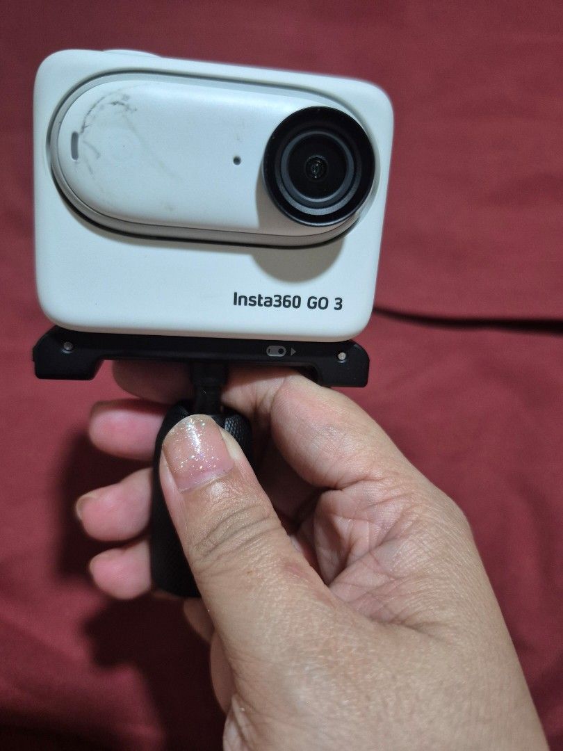 Insta360 GO 3 Action Camera with Mount (Category: Video Cameras) located in Caloocan City. Submitted by wandererrs (Listing ID 1469040755, Image 2). Description: - Item: Insta360 GO 3 Action Camera - Color: White - Condition: Fully functional, with some scuff marks on the front of the small camera unit - Inclusions: Action Pod with touchscreen flip screen, quick release mount, and magnetic camera unit - Features: Ultra-compact size, perfect for P