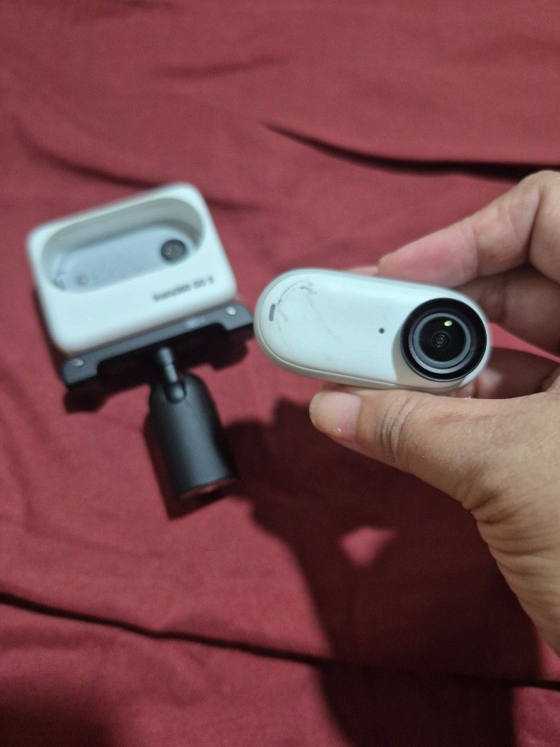 Insta360 GO 3 Action Camera with Mount (Category: Video Cameras) located in Caloocan City. Submitted by wandererrs (Listing ID 1469040755, Image 1). Description: - Item: Insta360 GO 3 Action Camera - Color: White - Condition: Fully functional, with some scuff marks on the front of the small camera unit - Inclusions: Action Pod with touchscreen flip screen, quick release mount, and magnetic camera unit - Features: Ultra-compact size, perfect for P