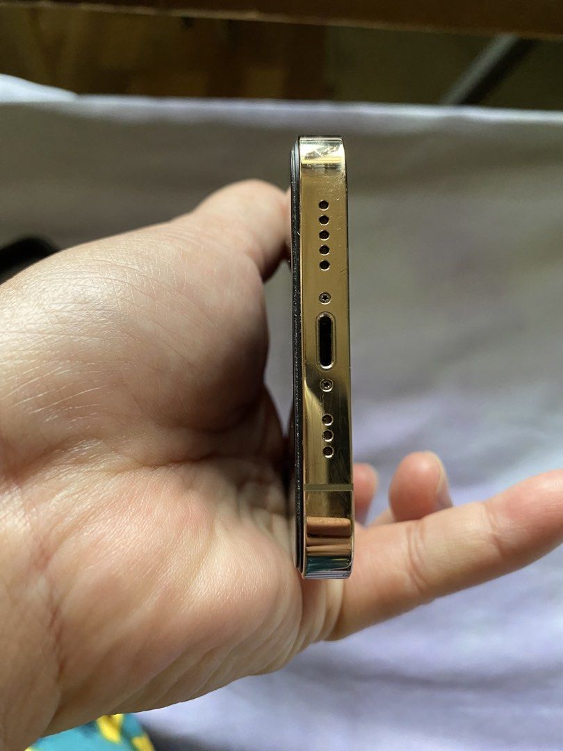Iphone12 pro 128 (Category: iPhone 12 Series) located in San Mateo. Submitted by domski23 (Listing ID 1469160245, Image 3). Description: - Model: iPhone 12 Pro - Storage: 128GB - Color: Premium Gold - Condition: Very good, well-maintained physical appearance with clean screen, back, and sides - Features: Triple camera setup, premium glossy gold stainless steel frame - Meetup location: SM City San Mateo Gpp chip use to unlock Meron n ksama isetup 