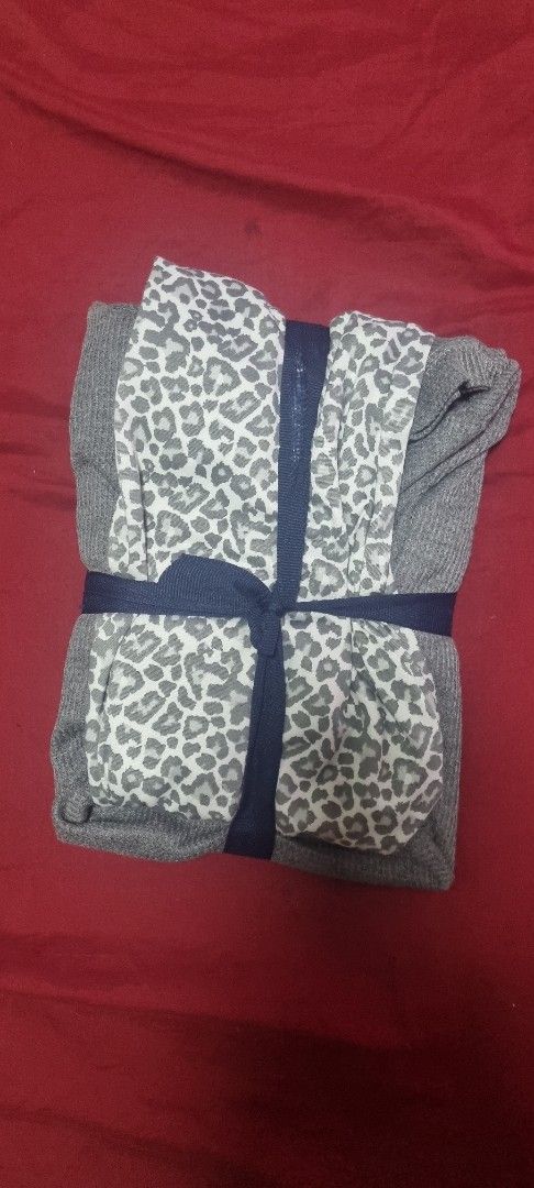 Isotoner Ladies 2PC Sleep Set Grey M (Category: Undergarments & Loungewear) located in Manila. Submitted by ags028705 (Listing ID 1469158778, Image 2). Description: - Brand: Isotoner - Type: Ladies 2-piece sleep set - Size: Medium - Color/Pattern: Grey waffle knit top with button detail + grey & white leopard print bottoms - Condition: Brand new, neatly folded in original cardboard packaging band.