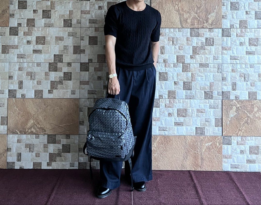 ISSEY MIYAKE BAOBAO - DAYPACK REFLECTOR BACKPACK (Category: Luxury Bags & Wallets) located in Bacolod City. Submitted by timelessbyjosh (Listing ID 1469112368, Image 2). Description: BEST FOR CASUAL & AVANT GARDE OUTFITS SIZE : ACTUAL COLOR : METALLIC GREY & BLACK COLOR RATE : 10 OUT OF 10 CONDITION : NEAR NEW MATERIAL : ( OUTER/BODY MATERIAL ) : POLYVINYL CHLORIDE ( BASE FABRIC/PART ) : POLYESTER ( LINING/STRAPS ) : NYLON ( HARDWARE/OTHER ) - BR