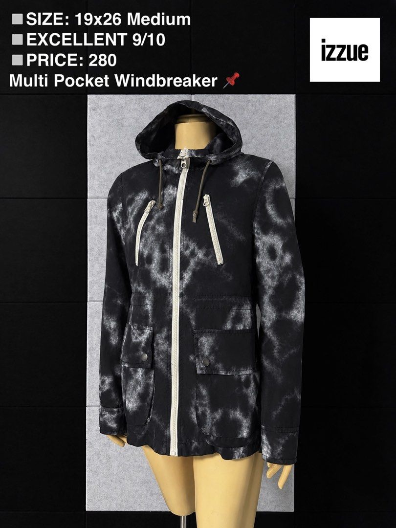 Izzue Black Tie-Dye Multi Pocket Windbreaker (Category: Coats, Jackets and Outerwear) located in San Rafael. Submitted by jules.ciao (Listing ID 1468947551, Image 1). Description: - Brand: Izzue - Style: Multi-pocket windbreaker jacket in a black & white tie-dye wash - Size: Medium (Pit to pit: 19", Length: 26") - Features: Full zip closure with white zipper tape, matching drawstrings, dual diagonal chest zip pockets, two lower button-flap pocket