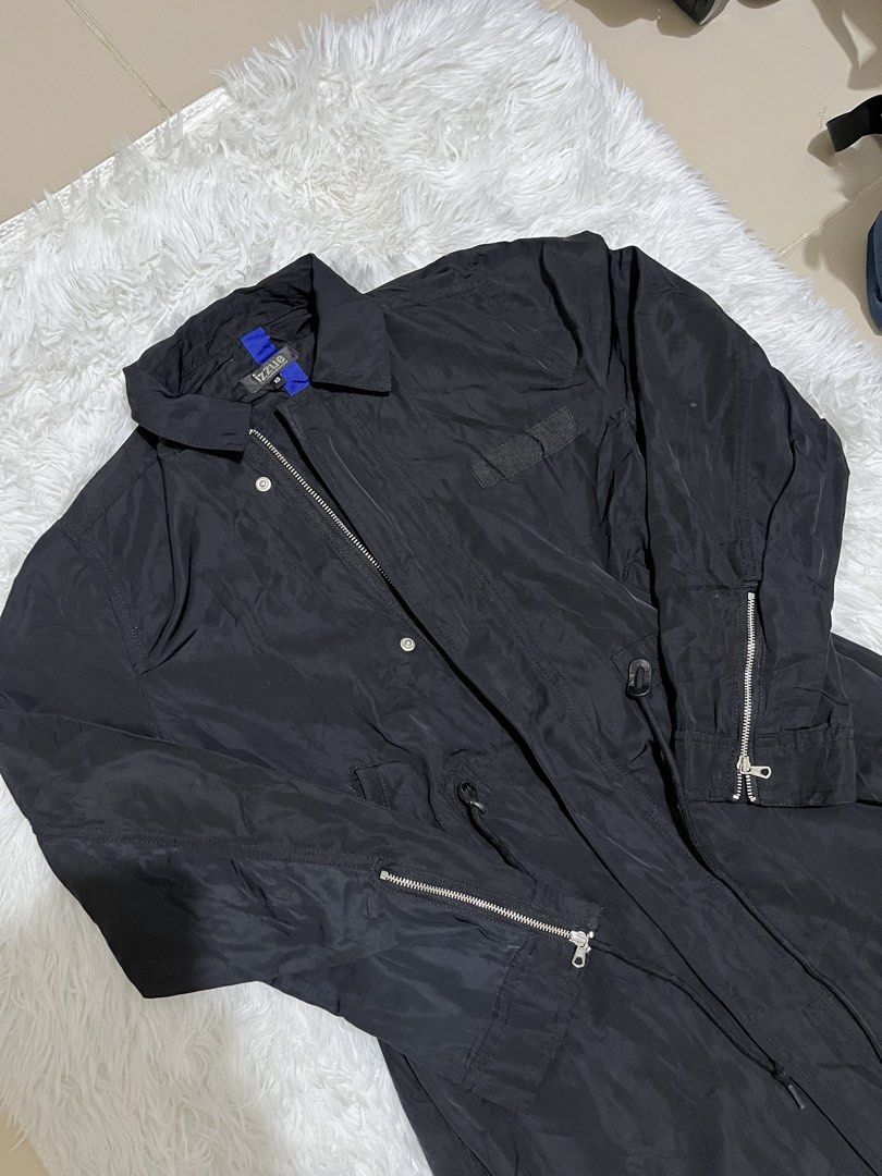 Izzue Longline Utility Trench Parka (Category: Coats, Jackets and Outerwear) located in Manila. Submitted by sophianne19 (Listing ID 1469044654, Image 1). Description: Selling an authentic IZZUE (Hong Kong Designer Streetwear Brand) Longline Utility Trench Parka. Very stylish piece with a black lightweight nylon exterior and an electric blue contrast inner trim/hem. Features premium zipper details on the sleeves, a drawstring waist for an adjusta