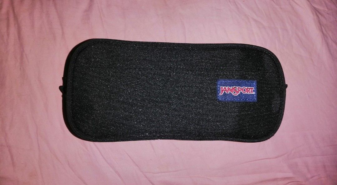 JanSport large accessory pouch Double Zip Pencil Case Pouch (Category: Belt bags, Clutches and Pouches) located in Quezon City. Submitted by rolenalma (Listing ID 1469100469, Image 1). Description: - Brand: JanSport - Color: Classic Black - Material: Heavy-duty canvas built for daily school use - Design: Rectangular shape with rounded corners and iconic logo patch - Storage: Dual zippered main compartments to easily organize pens and stationery -