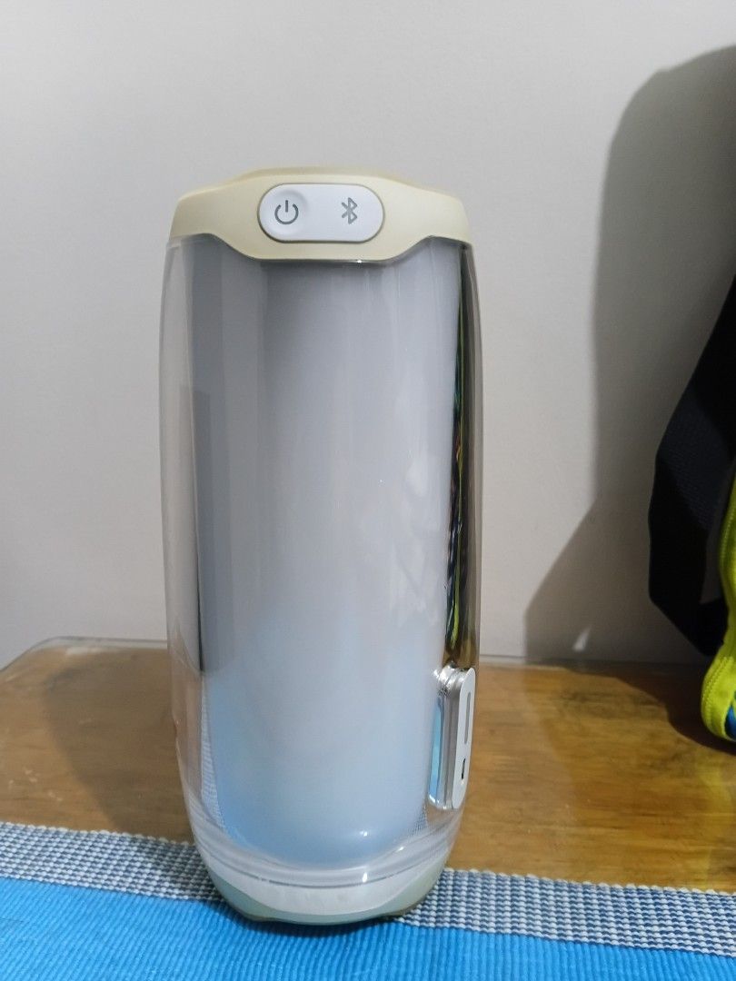 JBL Pulse 4 Wireless Bluetooth Speaker (Category: Soundbars, Speakers & Amplifiers) located in Cainta. Submitted by martin.a1021 (Listing ID 1469101843, Image 3). Description: - Authentic JBL Pulse 4 wireless Bluetooth speaker in a stylish white and cream colorway - Stunning 360-degree LED light show for immersive room ambiance - Used with noticable yellowing .