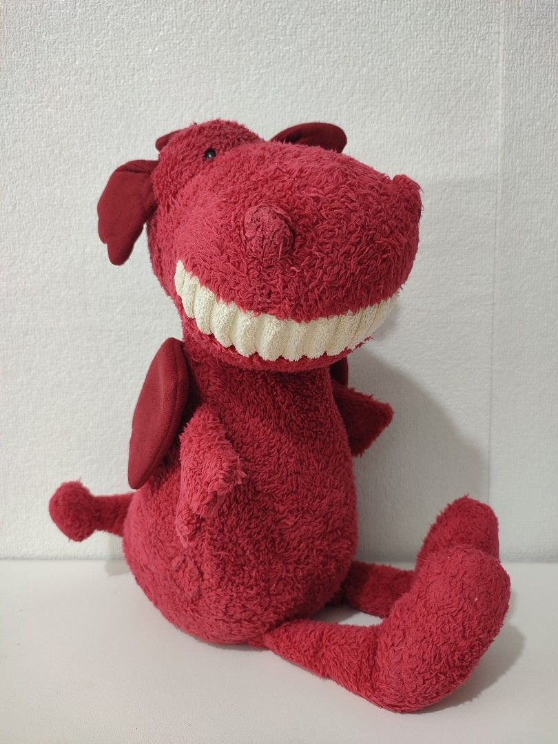 Jellycat Red Dragon Soft Toy (Category: Plushies & Soft Toys) located in Manila. Submitted by epicmountain-f20453 (Listing ID 1469116152, Image 1). Description: - Brand: Jellycat London - Character: Bright red plush dragon - Condition: Brand new with tag attached - Size: Standard medium plush - Features: Textured fur, fabric wings, and a wide smiling face with white teeth - Ideal for: Jellycat collectors, kids, and gifting.
