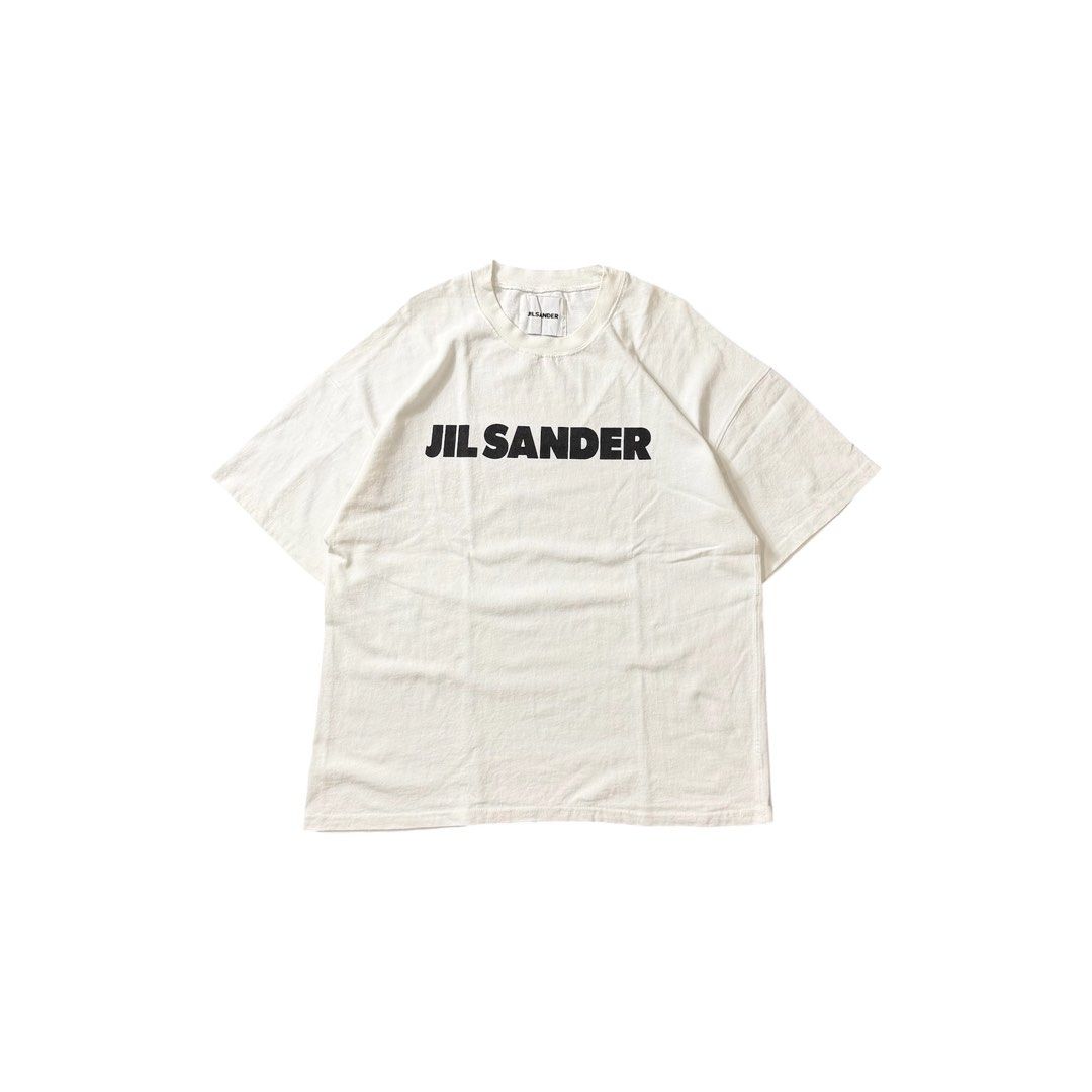 Jil Sander Logo White T-Shirt (Category: Shirts) located in Dagupan City. Submitted by dgp.plvg (Listing ID 1468952657, Image 1). Description: J1L SANDER SCRIPT TEE Size: Large-XL boxy Width: 24” Length: 29” Condition: good as new. Issues: none. Mine: ₱2,000.