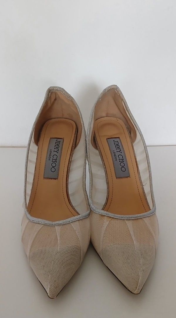 Jimmy Choo Shoes (Category: Heels) located in Batangas. Submitted by thriftshop_izy15 (Listing ID 1469009208, Image 2). Description: - Brand: Jimmy Choo - Style: Pointed toe stiletto pumps with ruched fabric - Material: Eye-catching silver glitter mesh - Condition: Soles show some signs of past use, but heels are structurally intact and sturdy - Inclusions: Classic branded insoles - Perfect for weddings, parties, and night outs! - Size: 36/23cm.