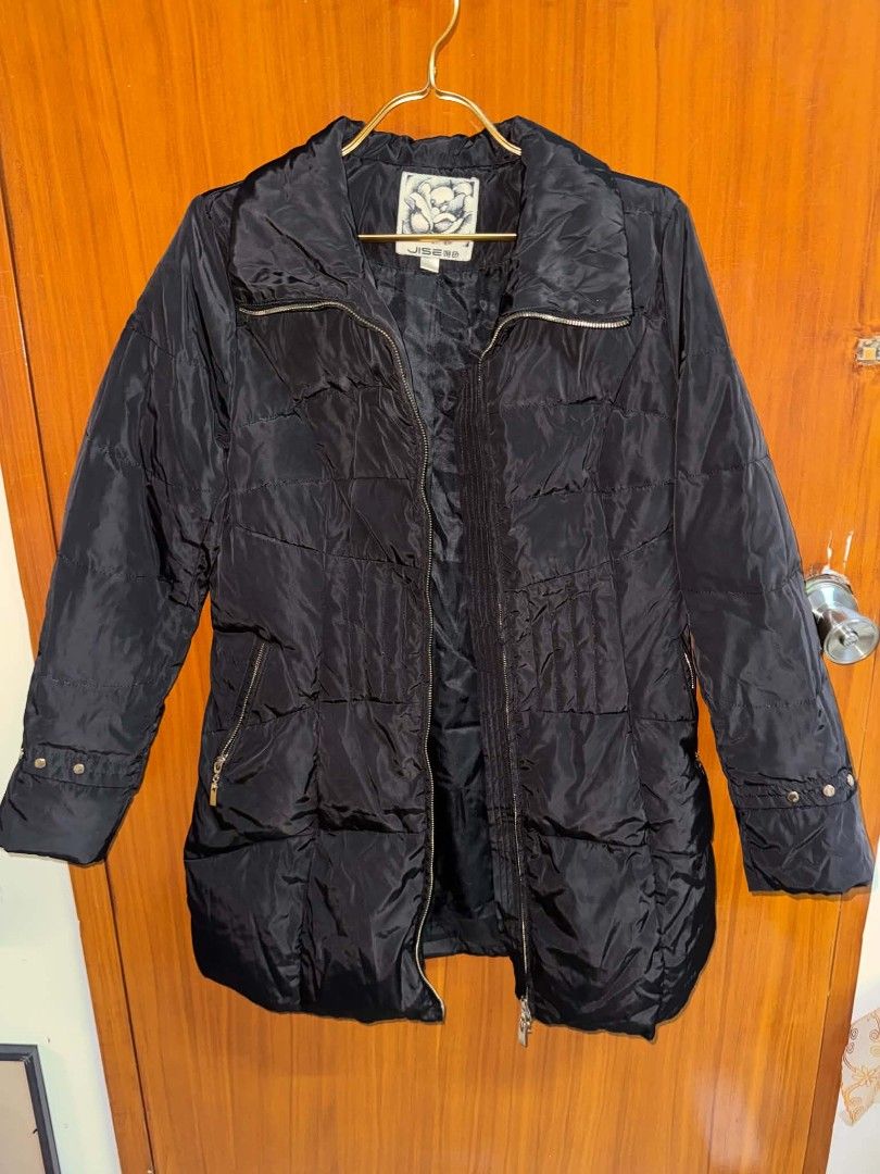 Jisen Black Quilted Winter Puffer Jacket (Category: Coats, Jackets and Outerwear) located in Caloocan City. Submitted by mylove326 (Listing ID 1469039633, Image 3). Description: - Brand: Jisen - Size: S-M - Color: Classic Black - Design: Quilted winter jacket with high collar and zip-up front - Fit: Vertical pleated paneling at the waist for a sleek, fitted silhouette - Pockets: Convenient zipped pockets on both sides - Condition: Clean, excellen