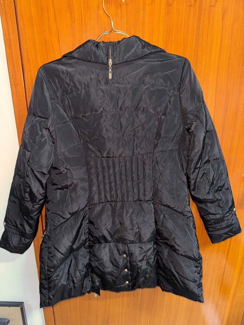 Jisen Black Quilted Winter Puffer Jacket (Category: Coats, Jackets and Outerwear) located in Caloocan City. Submitted by mylove326 (Listing ID 1469039633, Image 2). Description: - Brand: Jisen - Size: S-M - Color: Classic Black - Design: Quilted winter jacket with high collar and zip-up front - Fit: Vertical pleated paneling at the waist for a sleek, fitted silhouette - Pockets: Convenient zipped pockets on both sides - Condition: Clean, excellen