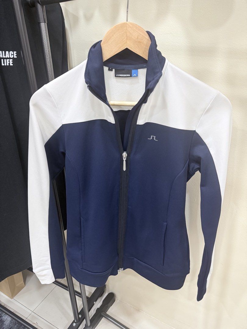 j.lindeberg Navy and White Full Zip Jacket (Category: Coats, Jackets and Outerwear) located in Quezon City. Submitted by nichole12 (Listing ID 1469107571, Image 1). Description: - Brand: J.Lindeberg - Style: Full-zip jacket with a two-tone color block design - Color: Navy and white - Size: Small (tag attached) - Features: Front pockets, small chest logo, ribbed collar, cuffs, and hem - Condition: Excellent, ready to wear.