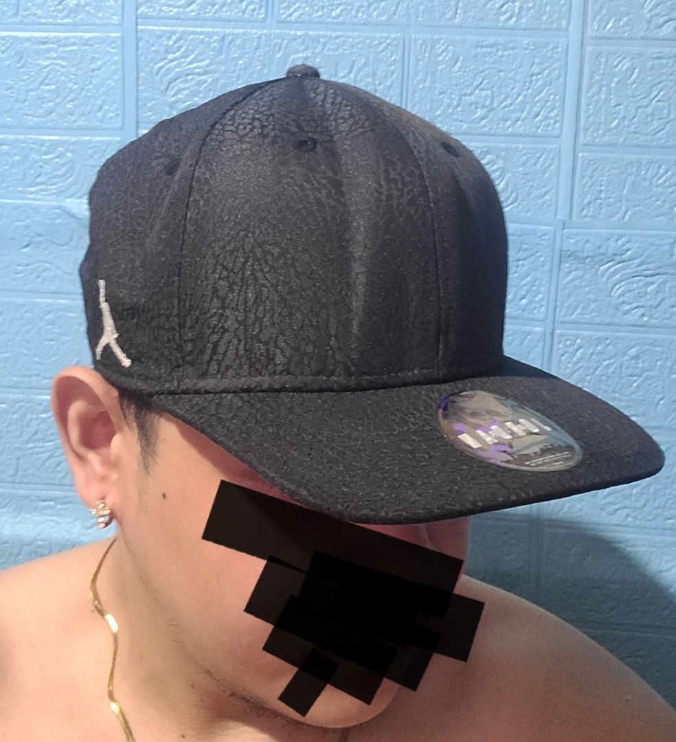 Jordan Black Elephant Print Snapback Cap Hat (Category: Caps & Hats) located in Caloocan City. Submitted by remwil18 (Listing ID 1468933633, Image 3). Description: - Authentic Jordan snapback cap in classic black - Iconic all-over elephant print texture - Embroidered white Jumpman logo on the side - Original hologram sticker still attached to the flat brim - Adjustable snapback closure for a custom fit - Verified style code HO160508ASH on inner t