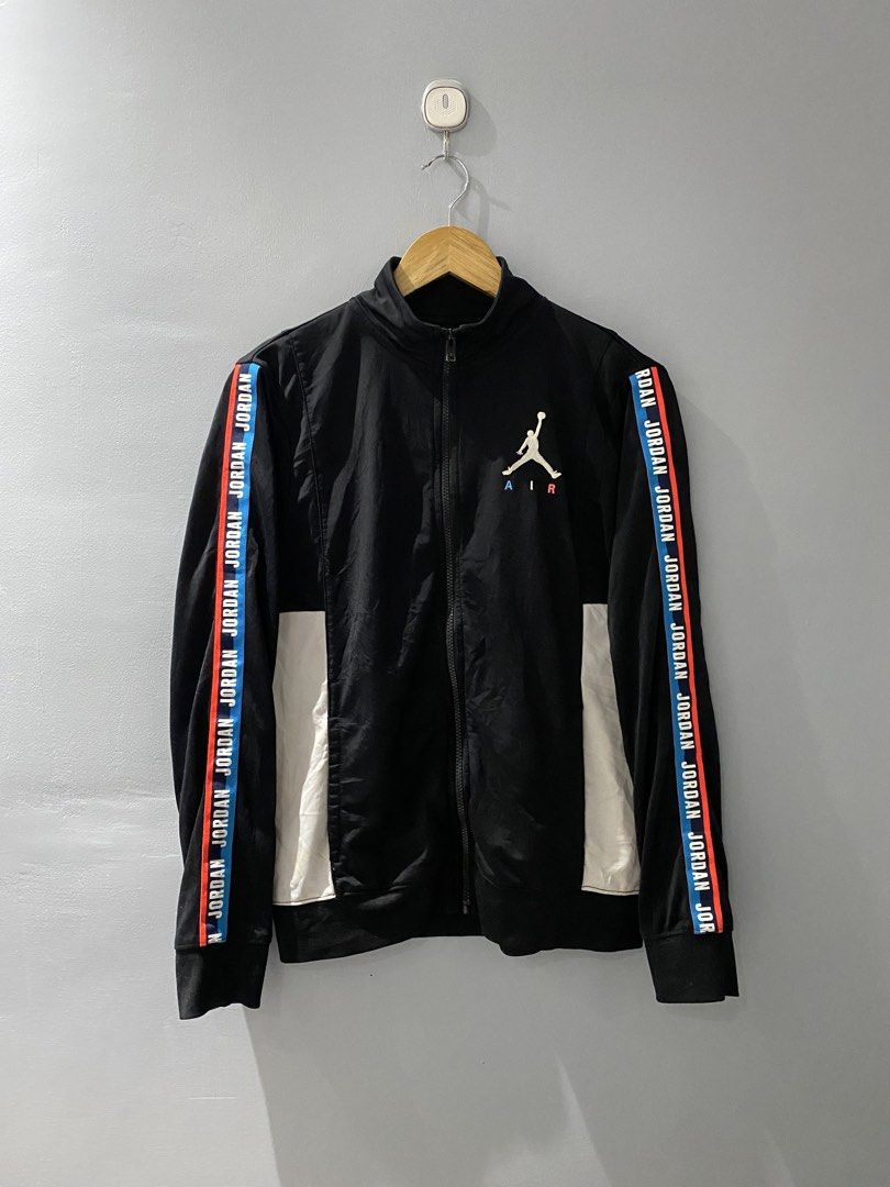 Jordan Black Track Jacket Youth XL (Category: Coats, Jackets and Outerwear) located in Bangued. Submitted by koroysthrifts (Listing ID 1469073082, Image 2). Description: - Brand: Jordan 20x25 - Color: Black with white side panels and branded tape - Details: Embroidered Jumpman logo with blue and red Air text, full zip, high collar, ribbed cuffs and hem - Size: Youth XL (fits ages 13-15 years / height 158-170 cm) - Material: Polyester (Made in Ind
