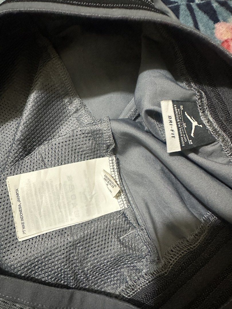 Jordan Dri-Fit Grey Athletic Shorts Size M (Category: Shorts) located in Cauayan City . Submitted by onins28 (Listing ID 1469068002, Image 2). Description: - Brand: Jordan - Color: Grey - Size: Medium - Technology: Nike Dri-Fit for moisture management - Design: Elastic waistband with striped details & large Jumpman logo on the left leg - Features: Inner mesh lining - Origin: Made in Thailand - Tag Code: B21918-085 - Condition: 100% authentic, per