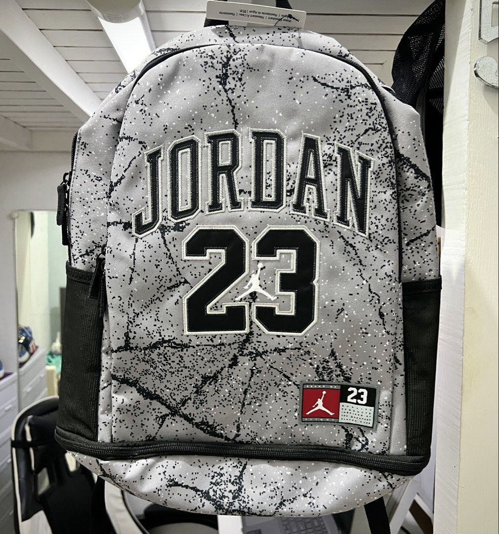 Jordan Elephant Print Backpack with Shoe Garage (Category: Backpacks) located in Tiaong. Submitted by rmu57 (Listing ID 1468976359, Image 1). Description: - Authentic Jordan backpack in grey and black elephant print - Features embroidered 'JORDAN 23' lettering and iconic Jumpman logo - Convenient side bottle pockets and comfortable padded shoulder straps - Dedicated bottom 'Shoe Garage' compartment for your kicks - Brand new with original hang ta