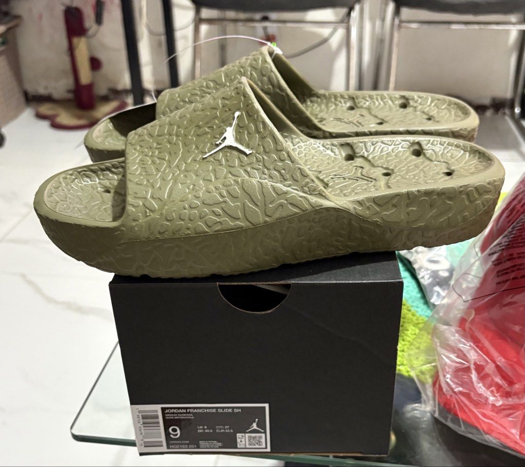 Jordan Franchise Shower Slides (Category: Slippers & Slides) located in Manila. Submitted by shoepatos4u (Listing ID 1469129409, Image 2). Description: Available sizes: - Mens us9/eur42/27cm - Mens us10/eur44/28cm - Olive green Jordan slides - Elephant print texture on strap - Jordan logo on top - Deep grooves on sole for enhanced grip - Includes original box - Size: 9 (US Men’s).