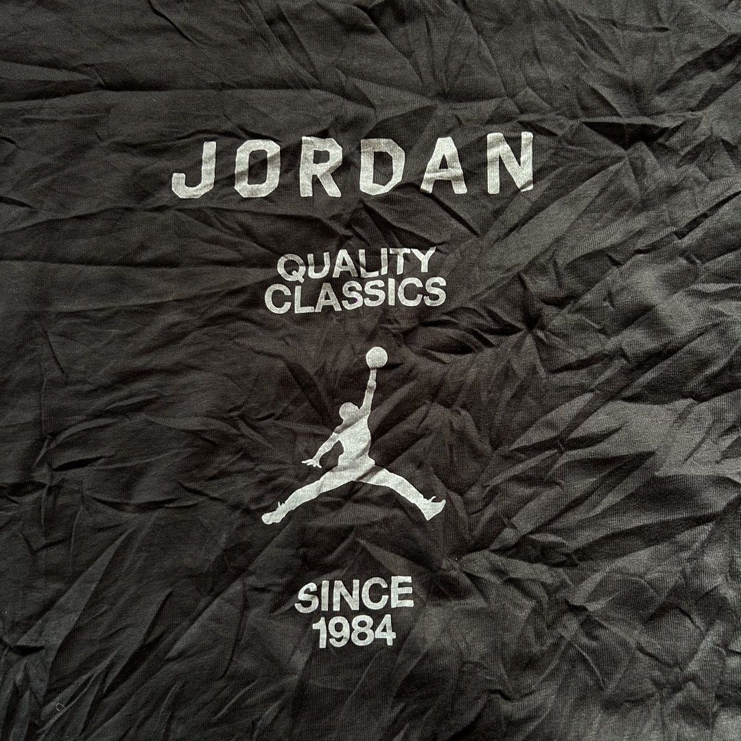 Jordan Quality Classics T-Shirt 🔥 (Category: Tshirts & Polo Shirts ) located in Jinoba-an. Submitted by eegiboy (Listing ID 1468997991, Image 3). Description: - Brand: Jordan - Color: Black - Size: L fit to medium Dimes: 21/25 Good as new no issue 550plussf Dm me if interested thankyou - Design: 'Quality Classics Since 1984' graphic with Jumpman logo on the front - Details: Round neckline, short sleeves, official inner neck tag - Product Code: F