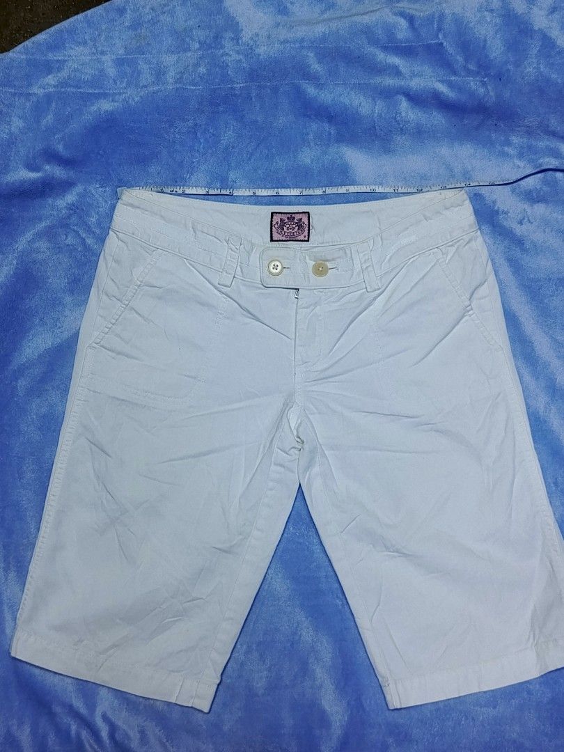 Juicy Couture White Cotton Shorts Size 2 (Category: Shorts) located in City of Isabela. Submitted by warmbird.d06e6f (Listing ID 1469082829, Image 1). Description: - Brand: Juicy Couture - Color: Clean White - Size: 2 (Waist measures ~15 inches across) - Material: 100% Cotton - Closure: Double-button closure with zip fly - Features: Front pockets, classic pink brand patch inside waistband - Details: Style No. 21062, PO No. 63081 - Condition: Exce