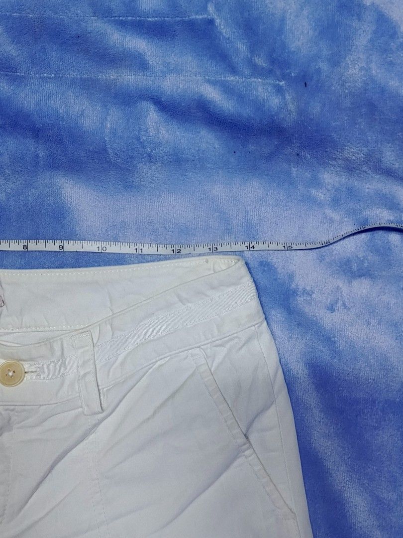 Juicy Couture White Cotton Shorts Size 2 (Category: Shorts) located in City of Isabela. Submitted by warmbird.d06e6f (Listing ID 1469082829, Image 2). Description: - Brand: Juicy Couture - Color: Clean White - Size: 2 (Waist measures ~15 inches across) - Material: 100% Cotton - Closure: Double-button closure with zip fly - Features: Front pockets, classic pink brand patch inside waistband - Details: Style No. 21062, PO No. 63081 - Condition: Exce