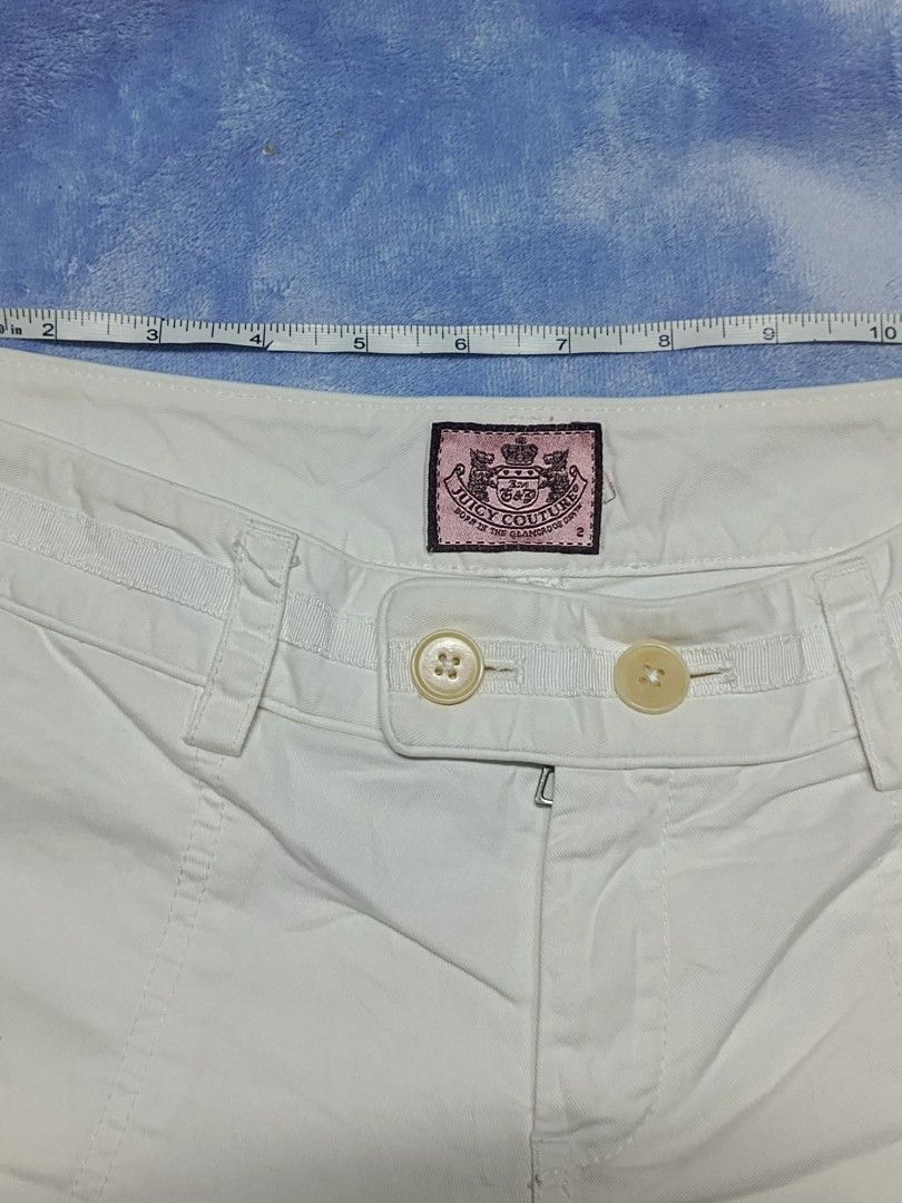 Juicy Couture White Cotton Shorts Size 2 (Category: Shorts) located in City of Isabela. Submitted by warmbird.d06e6f (Listing ID 1469082829, Image 3). Description: - Brand: Juicy Couture - Color: Clean White - Size: 2 (Waist measures ~15 inches across) - Material: 100% Cotton - Closure: Double-button closure with zip fly - Features: Front pockets, classic pink brand patch inside waistband - Details: Style No. 21062, PO No. 63081 - Condition: Exce