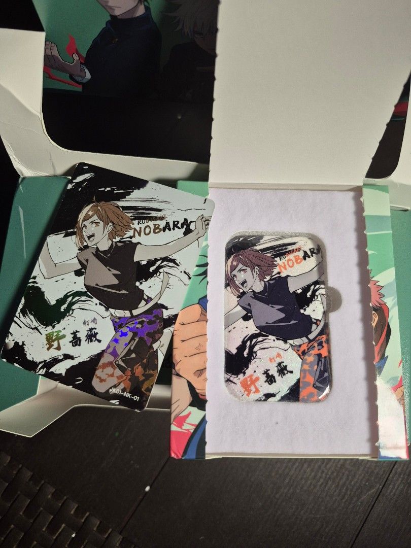 Jujutsu Kaisen Badge Pin with photocard (Category: Designer & Blind Box Toys) located in Malasiqui. Submitted by yoonisthings (Listing ID 1469069517, Image 2). Description: Get 2 items in 1 pack! Each box includes a Rectangular Metal Badge Pin and a matching Holographic Art Card. Product Type: Collectible Metal Badge Pin / Tinplate Badge Material: High-Quality Tinplate / Metal Base Size: Approx. 90mm x 20mm x 110mm (Box Dimension) AVAILABLE CHARA