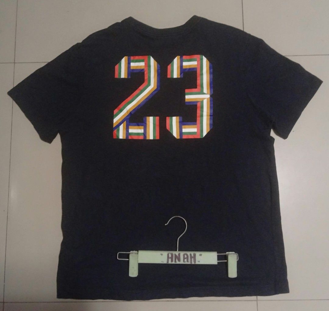 Jumpman 23 Graphic (Category: Tshirts & Polo Shirts ) located in Valenzuela. Submitted by AnahThrift (Listing ID 1469063546, Image 2). Description: - Brand: Jordan - Color: Black with multi-color stripe design - Size: XL (Standard Fit) - Material: 100% Cotton, Made in China - Design: Jumpman logo on front, number 23 on back - Measurements (Taped): 21 inches width x 27.5 inches length.