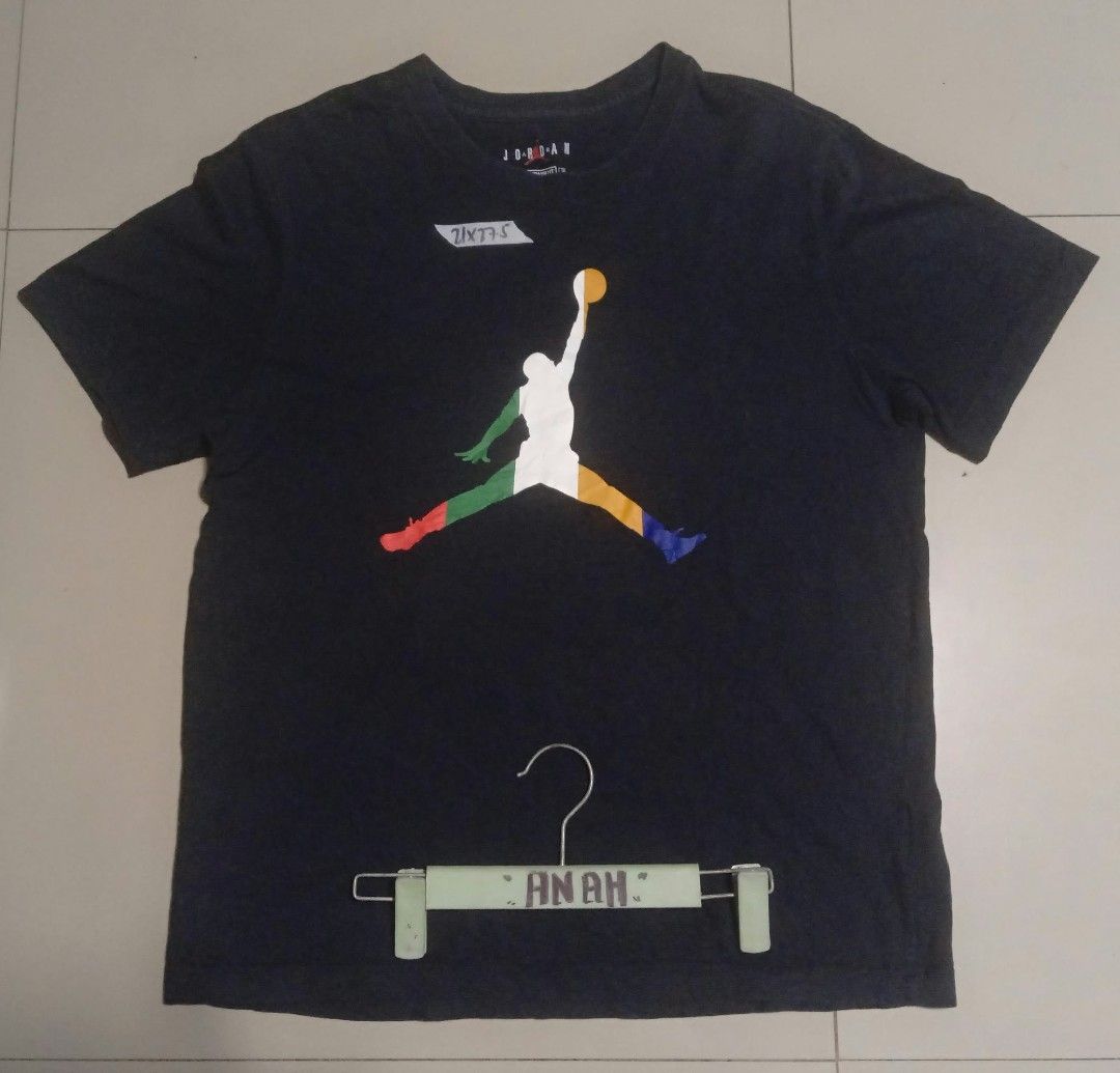 Jumpman 23 Graphic (Category: Tshirts & Polo Shirts ) located in Valenzuela. Submitted by AnahThrift (Listing ID 1469063546, Image 1). Description: - Brand: Jordan - Color: Black with multi-color stripe design - Size: XL (Standard Fit) - Material: 100% Cotton, Made in China - Design: Jumpman logo on front, number 23 on back - Measurements (Taped): 21 inches width x 27.5 inches length.