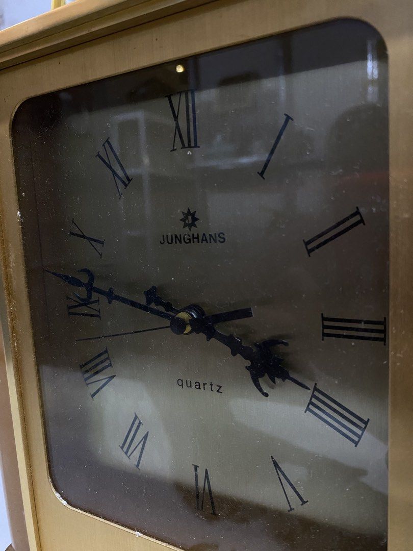 Junghans Quartz Mantel Clock Vintage Gold Tone (Category: Clocks) located in Calamba. Submitted by chebvintagedepot (Listing ID 1469036347, Image 2). Description: (B17-01) Vintage Junghans Astra quartz desk or mantle clock, likely dating from the 1970s–1980s. Made in Germany, it features a golden-tone brass finish with a resin or Lucite-style casing, black Roman numerals, and ornate hands. The clock has a classic vintage look, suitable for displa