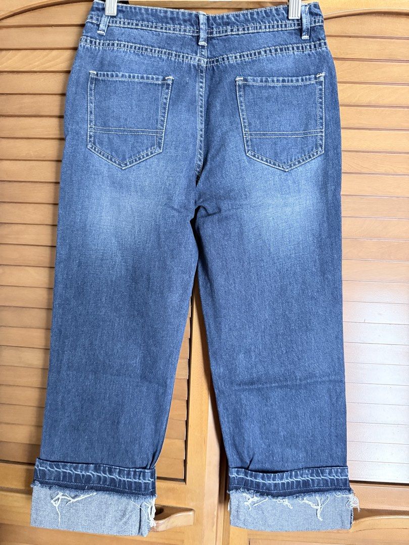 Just G Jeans (Category: Jeans) located in Paranaque City. Submitted by roanclauds (Listing ID 1468953691, Image 2). Description: - Brand/Item: Just G blue denim jeans - Fit: Mid-rise waist with classic straight leg cut - Details: Brass-toned front button, distressed right thigh and left pocket - Hem: Folded cuffs with raw edges - Pockets: Functional back pockets included.