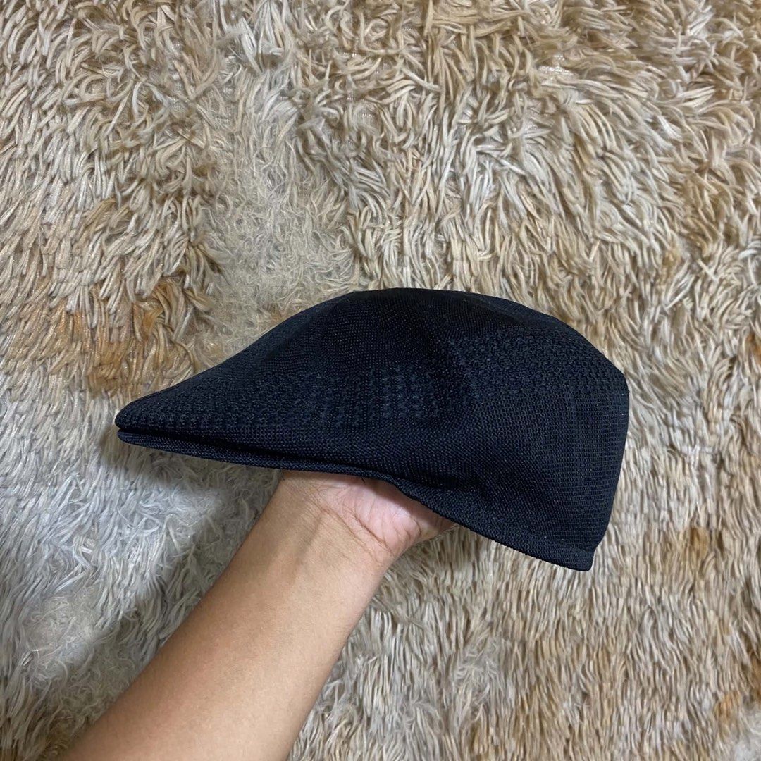 Kangol Black Flat Cap Beret (Category: Caps & Hats) located in Butuan. Submitted by jc13thrifts (Listing ID 1469064430, Image 2). Description: - Authentic Kangol black flat cap - Iconic white embroidered kangaroo logo on the back - Classic textured knit mesh material for breathability - Structured front brim for a sharp look - Clean interior sweatband.