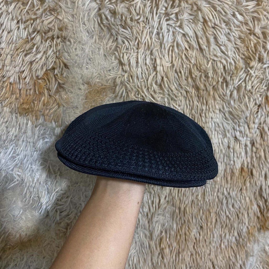 Kangol Black Flat Cap Beret (Category: Caps & Hats) located in Butuan. Submitted by jc13thrifts (Listing ID 1469064430, Image 1). Description: - Authentic Kangol black flat cap - Iconic white embroidered kangaroo logo on the back - Classic textured knit mesh material for breathability - Structured front brim for a sharp look - Clean interior sweatband.