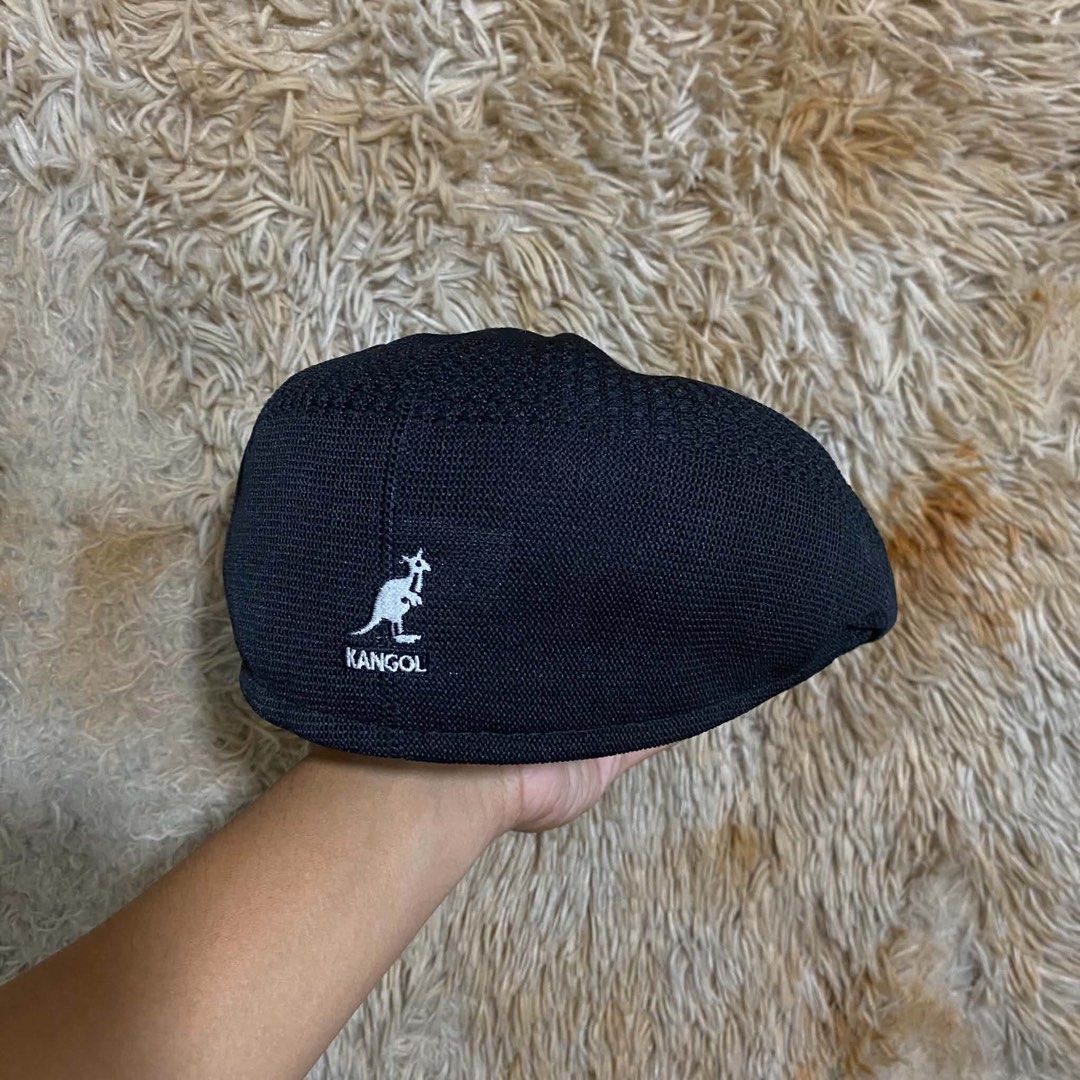 Kangol Black Flat Cap Beret (Category: Caps & Hats) located in Butuan. Submitted by jc13thrifts (Listing ID 1469064430, Image 3). Description: - Authentic Kangol black flat cap - Iconic white embroidered kangaroo logo on the back - Classic textured knit mesh material for breathability - Structured front brim for a sharp look - Clean interior sweatband.