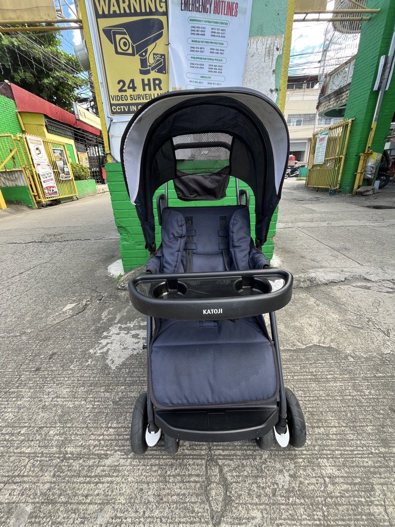 Katoji Double Stroller Navy Blue Foldable (Category: Strollers) located in Manila. Submitted by batusaipus03057 (Listing ID 1468990240, Image 2). Description: ❤️Katoji Two-Seater / Sit-and-Stand Tandem Stroller❤️ Key Features & Specifications • Design: Tandem 2-seater stroller with a front reclining seat and a rear sit-and-stand platform/seat. • Age & Weight Limits: • Front Seat: Suitable from 4/6 months up to 20 kg (44.1 lbs) with 3-level reclin