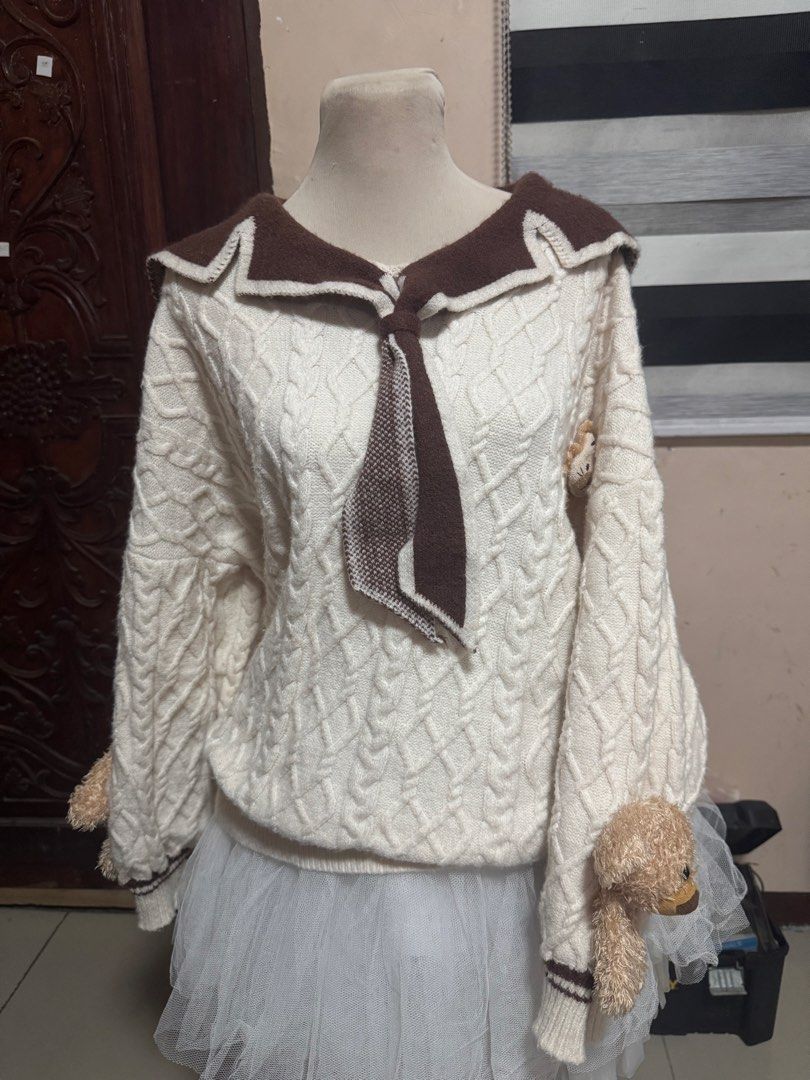 Kawaii Bear Sailor Collar Cable Knit Sweater (Category: Coats, Jackets and Outerwear) located in Manila. Submitted by athanaxia (Listing ID 1469058447, Image 1). Description: - Cream cable knit sweater with brown sailor collar - Big bear graphic embroidered on the back sailor flap - Cute attached plush teddy bears on both sleeves - Front neck tie detail - Cozy, thick winter knit with an oversized fit.