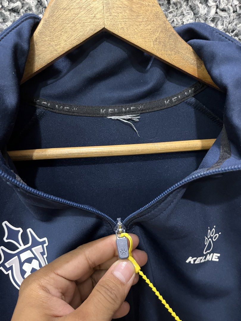 Kelme Track Jacket | Size M (Category: Coats, Jackets and Outerwear) located in General Trias. Submitted by zrchustle.604 (Listing ID 1469074004, Image 3). Description: Kelme Track Jacket (Model 8061WT1007.9428) in a dark navy blue, royal blue, and white colorway. It is constructed from a lightweight polyester and cotton blend fabric tailored for training, soccer, or casual athleisure wear..