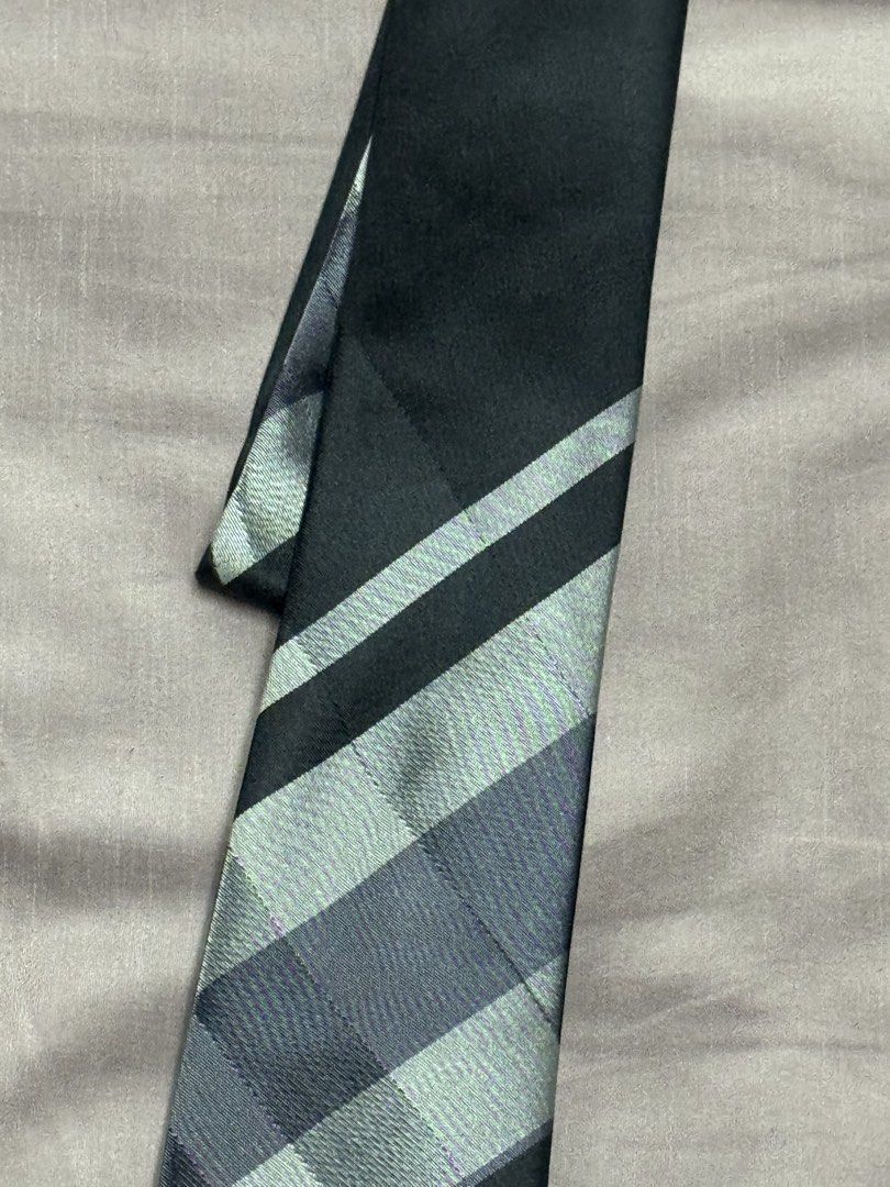 Kenneth Cole New York Slim Tie Black Grey Pattern (Category: Ties) located in Manila. Submitted by seangoart (Listing ID 1469048770, Image 2). Description: - Brand: Kenneth Cole New York - Design: Black and grey checkered pattern near the bottom, solid black top - Style: Modern slim cut - Condition: Clean fabric with tag clearly attached on the back - Versatility: Easy to match with a crisp white shirt and tailored suit for work or formal events.