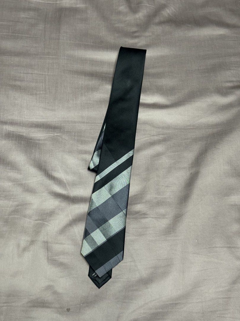 Kenneth Cole New York Slim Tie Black Grey Pattern (Category: Ties) located in Manila. Submitted by seangoart (Listing ID 1469048770, Image 1). Description: - Brand: Kenneth Cole New York - Design: Black and grey checkered pattern near the bottom, solid black top - Style: Modern slim cut - Condition: Clean fabric with tag clearly attached on the back - Versatility: Easy to match with a crisp white shirt and tailored suit for work or formal events.
